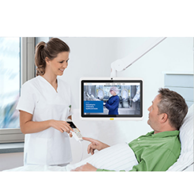 A nurse is talking to a patient using the GK-WH133-RK3288-A8.1-DS/TM 13.3" Android PoE Tablet for Telemedicine and Digital Signage in a hospital bed.