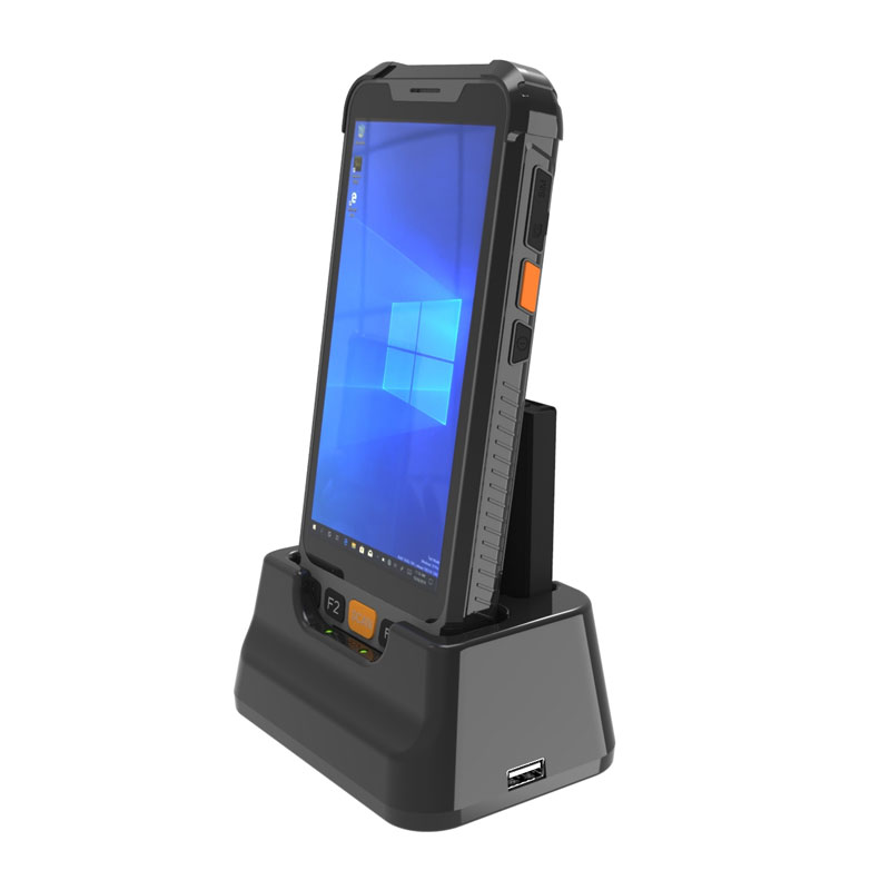 A GKSH55W 5.5" Rugged Windows OS handheld with barcode & RFID/UHF reader is sitting on top of a docking station.