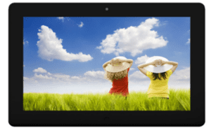 A tablet pc with two girls in hats on a grassy field.