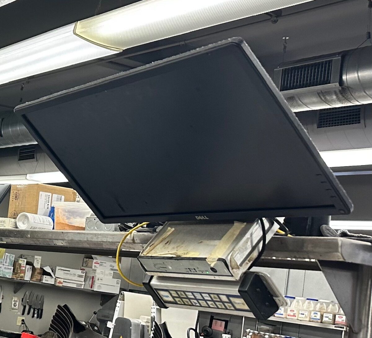 Monitor and keyboard in industrial setting.